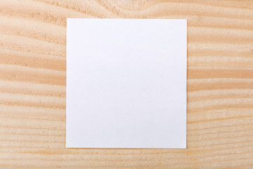 Blank paper on wood background