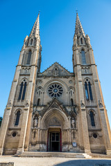 Fototapeta na wymiar Fascade of Cathedral Saint Baudile in the Nimes