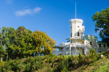 Keila-Joa manor (Schloss Fall) on hillside against blue sky