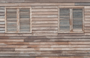 Windows on wooden wall background