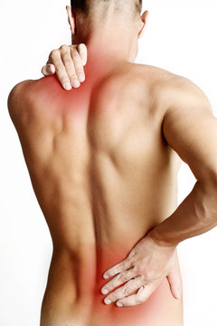 Studio shot of young man with pain in neck