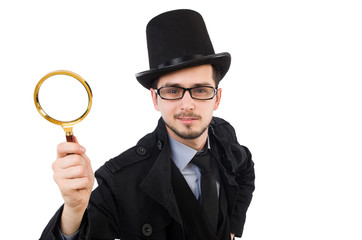 Young detective with magnifying glass isolated on white
