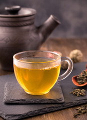 Glass cup of tea on table