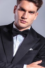 elegant young business man wearing a tuxedo.