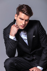 Elegant young business man looking down