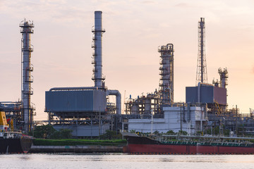 Oil Refinery with the cargo ship parking near riverside in the C