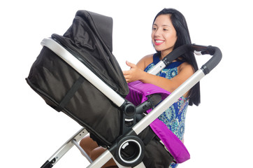 Happy mom with her baby in pram 