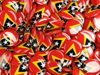 Background with round pins with flag of east timor