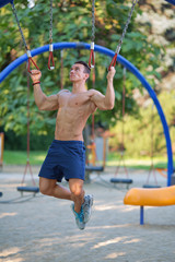 Muscular handsome man training outdoor