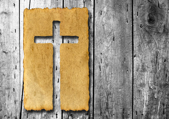 Old vintage paper with cross over wood