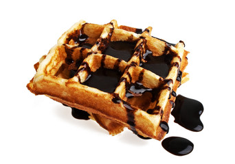Freshly baked belgium waffles with chocolate on white background