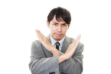 禁止の意思表示をするビジネスマン