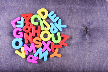 colorful plastic English alphabet on a bright background