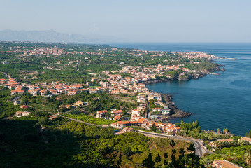 Fototapeta na wymiar Aerial view of towns along the eastern coast of Sicily, near Catania