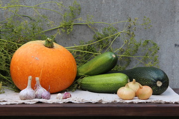 A harvesting time. A pumpkin, the marrows, the garlics, the onions.   © makarova