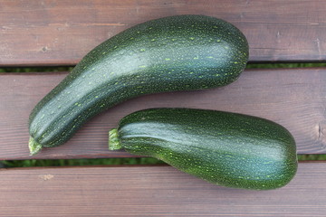 A harvesting time. Two vegetable marrows. A view from above.
