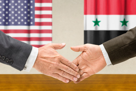 Vertreter der USA und Syriens reichen sich die Hand
