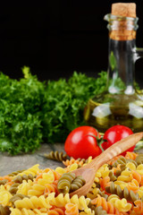 Raw eliche tricolori pasta background
