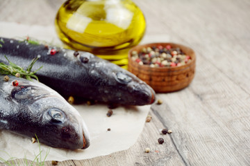 Raw seabass fish on the wooden board