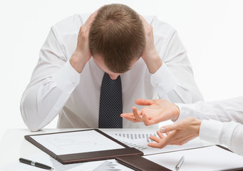Weary clerk sitting at the table