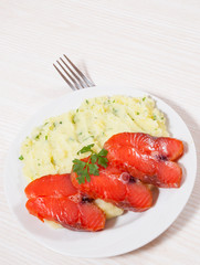 salmon steak with mashed potatoes on the plate