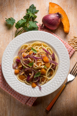 spaghetti with pumpkin onion and parsley