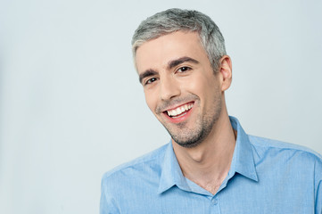 Smiling young man posing to the camera