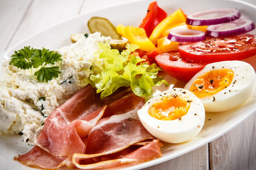 Breakfast - boiled egg, bacon, cottage cheese and vegetables
