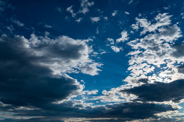 Deep blue sky with clouds.