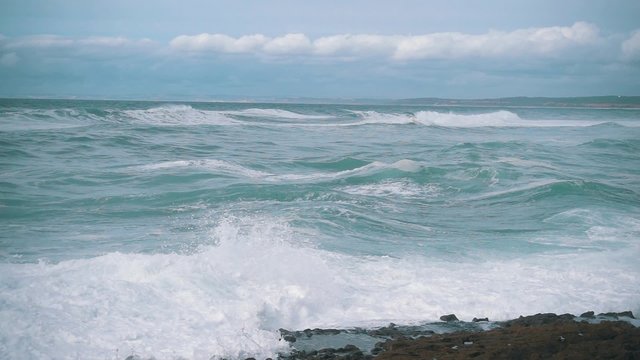 Slow Motion Ocean Waves Breaking on Shore, storm weather
