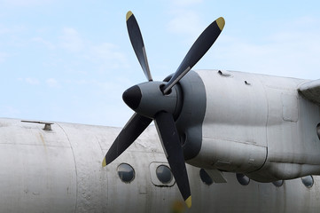 Naklejka na ściany i meble Engine propeller airplane on the background of the body