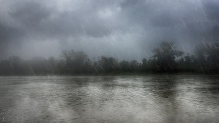 Heavy rain over a river