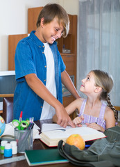 Portrait of children with textbooks and notes
