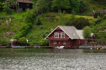 Fototapeta na wymiar red houses on a lake coast