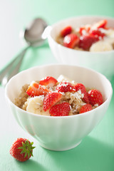 healthy breakfast quinoa with strawberry banana coconut flakes