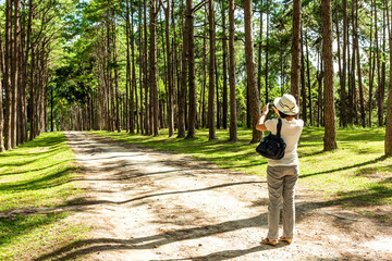 women travelers taking a photograph the walkway lane path 