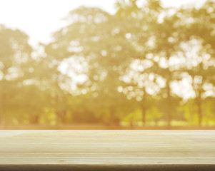 Empty table and blurred sunset tree  background for your product