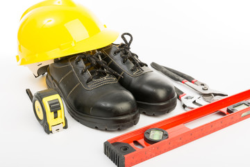 Fototapeta premium Yellow hard hat and tools