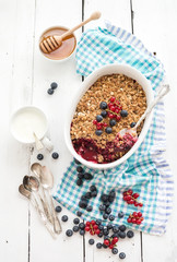 Healthy breakfast. Oat granola berry crumble with fresh