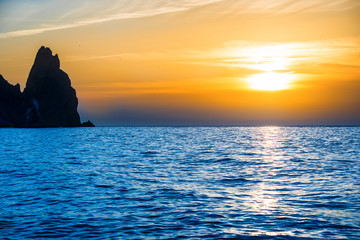 Obrazy na Szkle  Sunset above blue sea