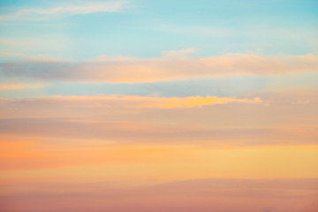 Pale sunset sky with pink, orange and red colors