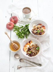 Healthy breakfast. Bowl of oat granola with yogurt, fresh fruit