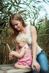 mother and daughter playing together outdoors