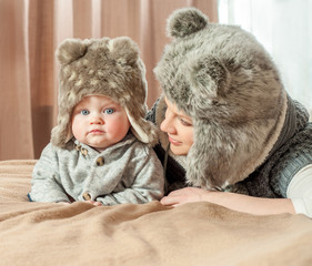 Mother and baby playing and smiling. Happy family.Home interior.
