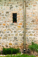 Background image of old church wall with a small window.
