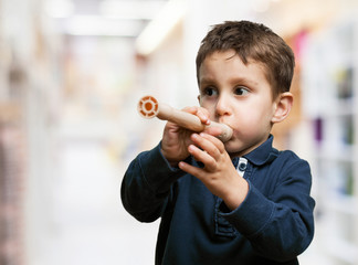 little kid playing flute © asierromero