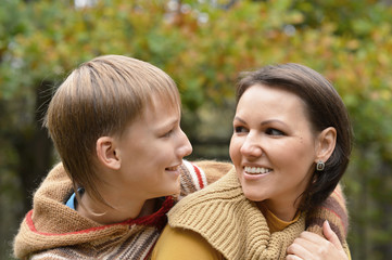 Mother with boy in autumn park