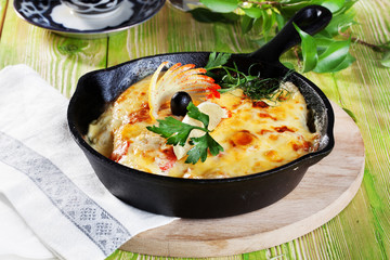 roast pan with mayonnaise sour cream sauce fish and lemon olives