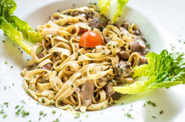 tasty pasta with roast ham on the table