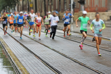 Unfocused Marathon running race in city streets